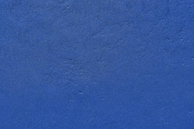 Mavi duvar alçı dokusu arka plan. Kaba alçı desenli duvar dokusu.