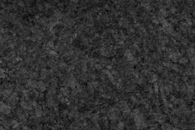 Koyu granit taş dokusunun desenli arka planı.