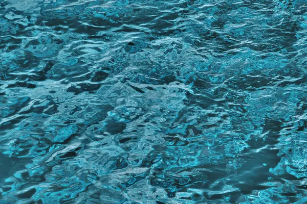 Blue sea water texture. Background of wavy blue water surface.