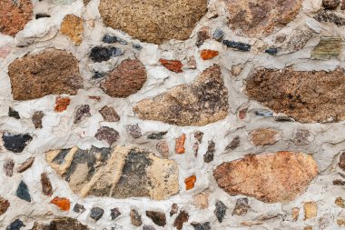 Küçük ve büyük taşlardan oluşan taş duvar arkaplanı. Taş dokusu.