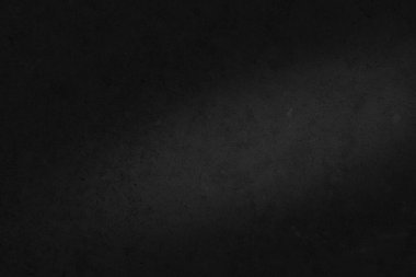 Siyah beton doku. Aydınlatılmış alana sahip koyu beton zemin.