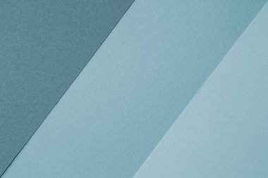 Mavi kağıt dokusu. Farklı tonlarda köşegen mavi kağıt katmanları olan minimal soyut arkaplan.