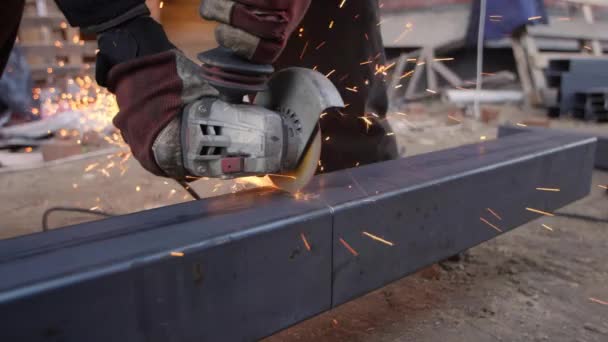 Workers Gloved Hands Hold Working Angle Grinder Cuts Thick Metal — Stockvideo