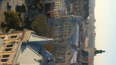 Vertical video. Flight over the old historical part of the city of Lviv. Drone view, Ukraine.