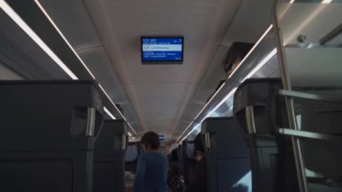 March 16, 2022. Gemania. Bavaria. Munich. Interior of fast train ICE. Intercity Express during day trip with people. Deutsche Bahn. DB railroad company in Germany. Public transport in Deutschland. 