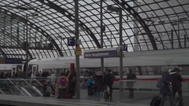 March 11, 2022. Berlin. Germany. Main station interior. Berlin Hauptbahnhof. People inside Berlin Central train station. Deutsche Bahn. General railway terminal Inside passengers, people and trains. 