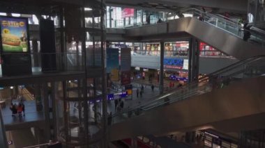 March 11, 2022. Berlin. Germany. Main station interior. Berlin Hauptbahnhof. People inside Berlin Central train station. Deutsche Bahn. General railway terminal Inside passengers, people and trains. 