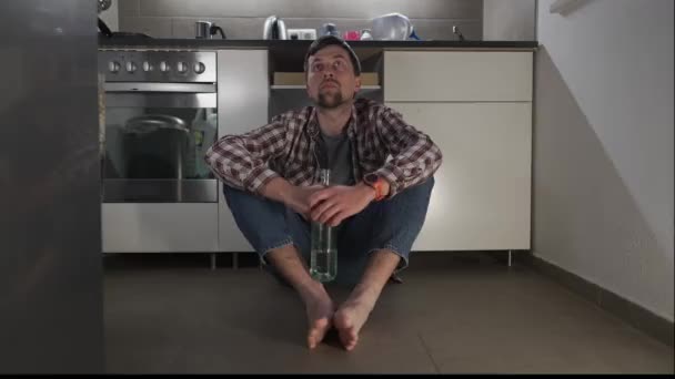 Drunk Sad Man Sitting Kitchen Floor Drinking Wine Bottle Drunken — ストック動画