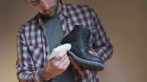 Man Applies Protective Oil His Winter Boots Protection Male Lubricates — Stock Video