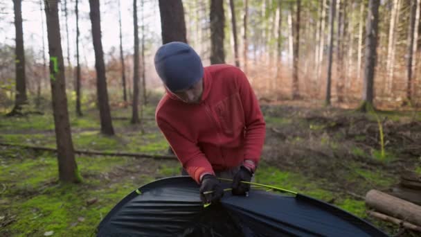 Tourist Makes Camp Woods Sets Tent Meadow Fall Forest Prepares — Vídeo de Stock