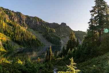 Beautiful views overlooking Mt. Rainier and lush greenery from Tolmie Peak trail at Mt. Rainier National Park. A high-quality photo taken in Mt. Rainier National Park, Washington state.  clipart