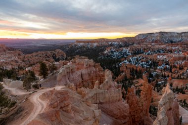 Stunning sunrise views of red rocks and hoodoos at Bryce Canyon National Park during golden hour. A high-quality photo taken at Bryce Canyon National Park, Utah. clipart