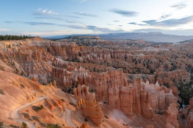 Stunning sunrise views of red rocks and hoodoos at Bryce Canyon National Park during golden hour. A high-quality photo taken at Bryce Canyon National Park, Utah. clipart