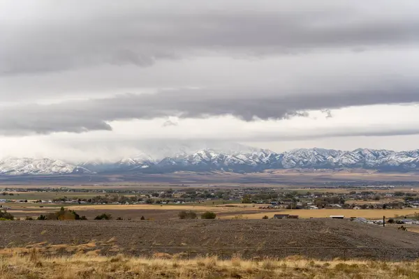 stock image A stunning scenic view of the Stansbury Mountain range on a cloudy day taken from Bates Canyon Trailhead. A high-quality photo taken near Tooele, Utah.