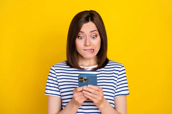 stock image Photo of pretty serious terrified lady arm hold telephone write get test distance remote work study isolated on yellow color background.