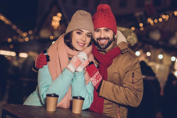 stock image Photo of adorable cute wife husband walking cuddling enjoying hot beverages mugs smiling outside city fair street.