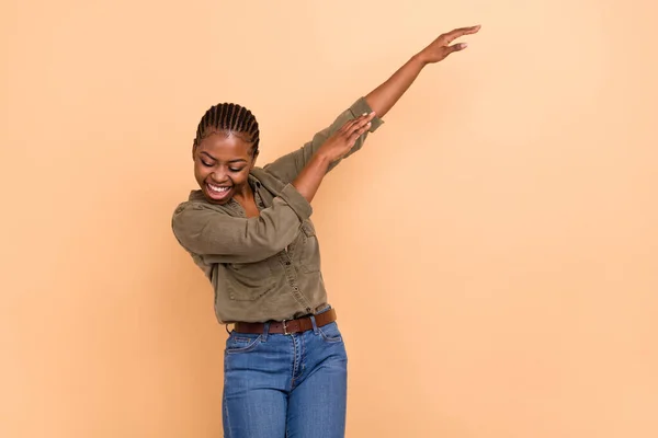 stock image Portrait of overjoyed satisfied lady enjoy dancing make moves dabbing isolated on beige color background.