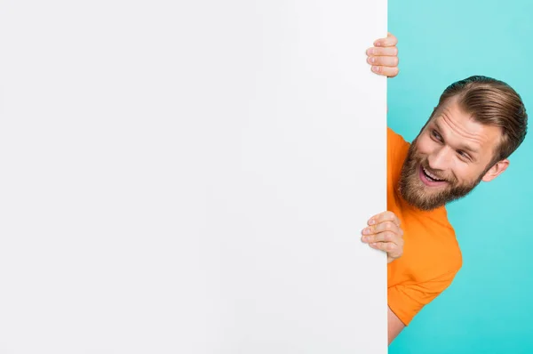 stock image Photo of cheerful man look interested empty space proposition isolated on turquoise color background.