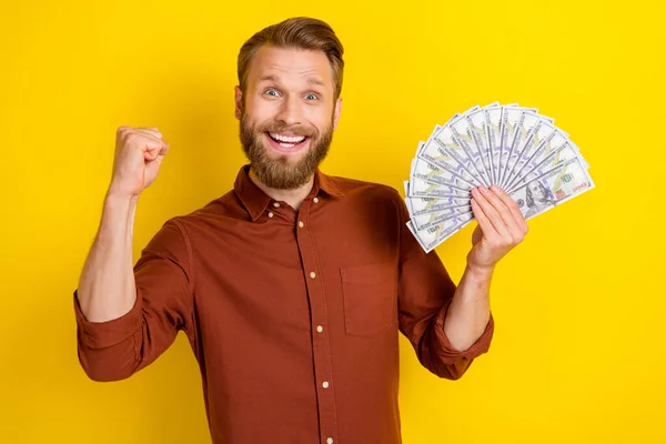 Photo Delighted Positive Person Hold Dollar Banknotes Bills Raise Fist — Stock Photo, Image