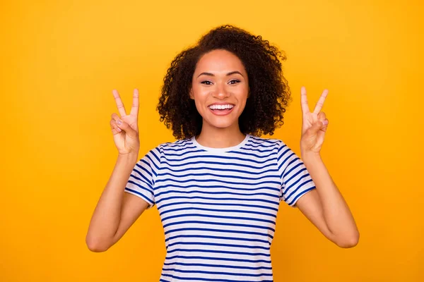 stock image Photo of cheerful funky lady wear white t-shirt smiling showing two v-signs isolated yellow color background.