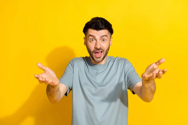 stock image Portrait photo of excited angry speechless bristle brunet handsome guy unsatisfied palms directing you failed mistake isolated on bright yellow color background.