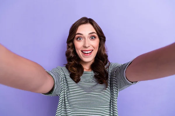 Photo of excited joyful cute lady make video content instagram facebook post give feedbak followers isolated on purple color background.