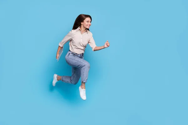 stock image Full size profile photo of positive energetic lady run jump good mood hurry blach friday shopping sale isolated on blue color background.