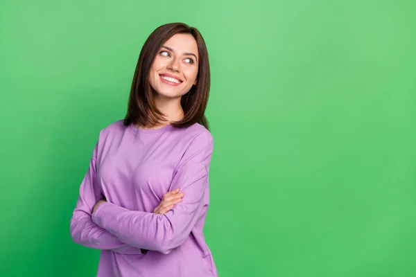 stock image Photo of young attractive smiling happy cute girl folded hands looking empty space isolated on green color background.