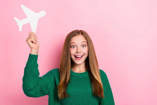 stock image Photo portrait of charming small girl hold paper airplane adventure dressed stylish green knitted garment isolated on pink color background.