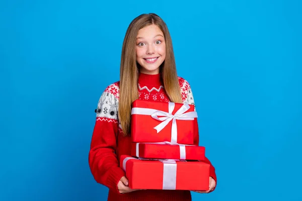 stock image Photo of good mood glad girl with straight hairstyle dressed red pullover hold red present boxes isolated on blue color background.