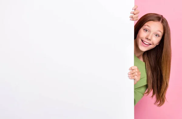 stock image Photo of impressed positive cheerful girl with straight hairstyle green sweater look out white placard isolated on pink color background.