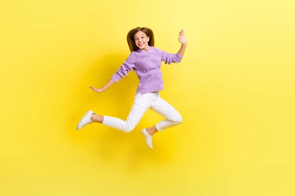 stock image Full length photo of overjoyed lady wear trendy violet knitted sweater good mood weekend holiday isolated on yellow color background.