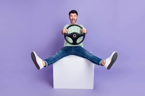 Full Size Photo Handsome Man Sit White Cube Hold Steering — Stock Photo, Image