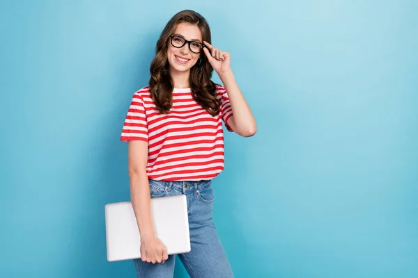 stock image Photo of pretty sweet girl dressed red t-shirt arm eyewear holding modern device empty space isolated blue color background.