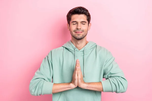 Photo of calm peaceful person closed eyes arms palms pleading isolated on pink color background.