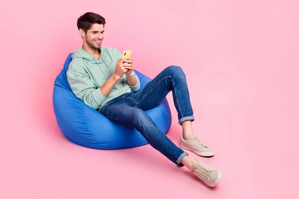 Full Length Photo Positive Man Sit Chair Use Modern Device — Zdjęcie stockowe