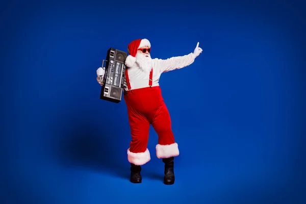 stock image Full length body size view of his he attractive cool fat Santa father having fun enjoying dancing carrying tape player night club isolated bright vivid shine vibrant red color background.
