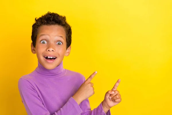 stock image Photo of adorable small boy impressed point copyspace cant believe discount dressed stylish purple look isolated on yellow color background.