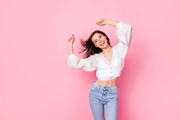 stock image Photo portrait of lovely young woman dance raise hands party disco dieting wear trendy white garment isolated on pink color background.