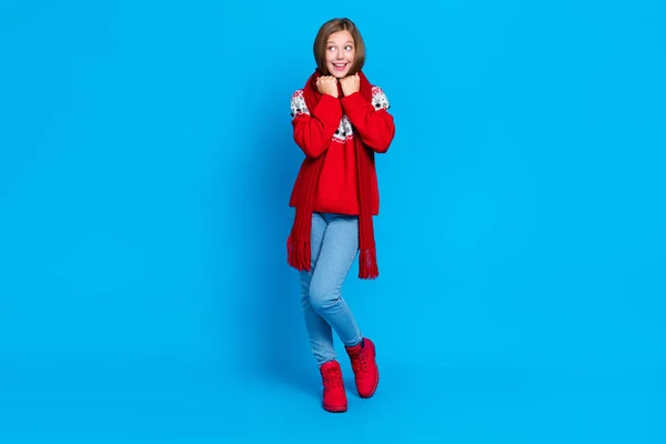 stock image Full length photo of charming dreamy school girl dressed red x-mas ornament pullover scarf looking empty space isolated blue color background.