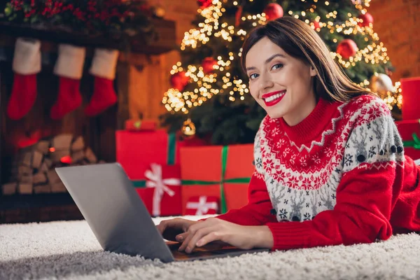 stock image Photo of adorable positive lady lying floor using modern device order courier delivery holiday dinner enjoy winter time house indoors.