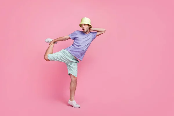 Full body photo of nice young guy crazy dance battle perform empty space dressed trendy blue clothes isolated on pink color background.