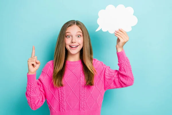 stock image Photo of smart nerd schoolgirl wear pink knitted sweater finger up eureka genius idea hold white paper cloud mockup isolated on blue color background.