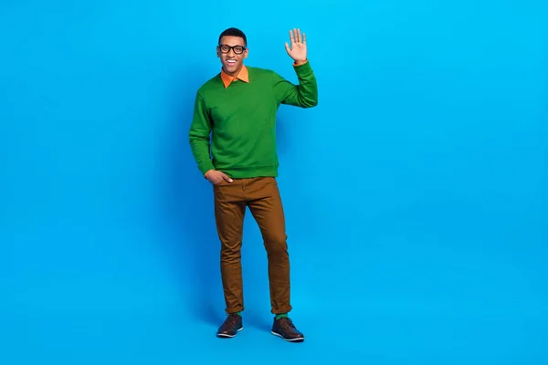 Full length size photo of satisfied school teacher young guy wear stylish gentleman outfit shake palm hello everybody isolated on blue color background.
