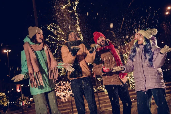 Photo of funky people diversity two couples laughing spend time like kid throwing snow up ukrainian christmas atmosphere chill outdoors.