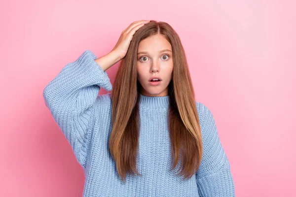 Photo of funny stressed confused nervous schoolgirl teenager touch hand head open mouth scared deadline problem isolated on pink color background.