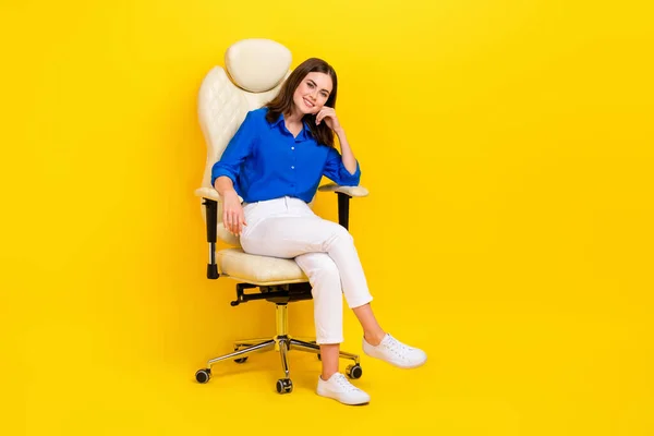Full body size photo of businesswoman relax inside office boss armchair touch cheeks look satisfied good profit isolated on yellow color background.