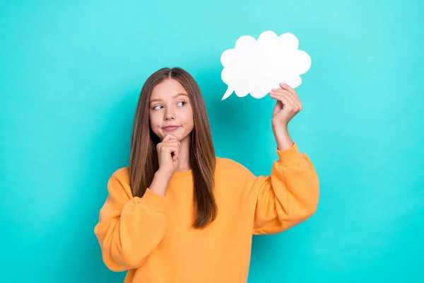 stock image Photo of young minded schoolgirl nerd touch chin look interested mockup hold paper cloud genius solution isolated on aquamarine color background.