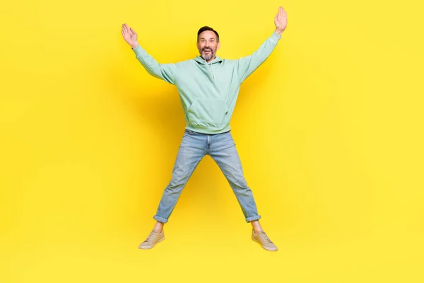 Full Length Photo Impressed Funny Guy Dressed Green Hoodie Jumping — Stock Photo, Image