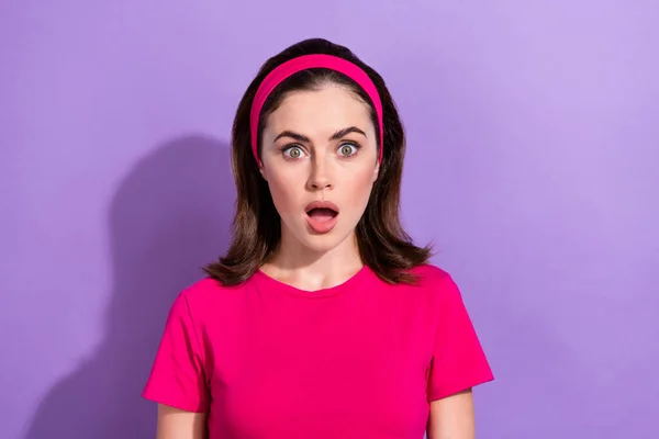 Portrait of shocked young person open mouth staring cant believe isolated on purple color background.